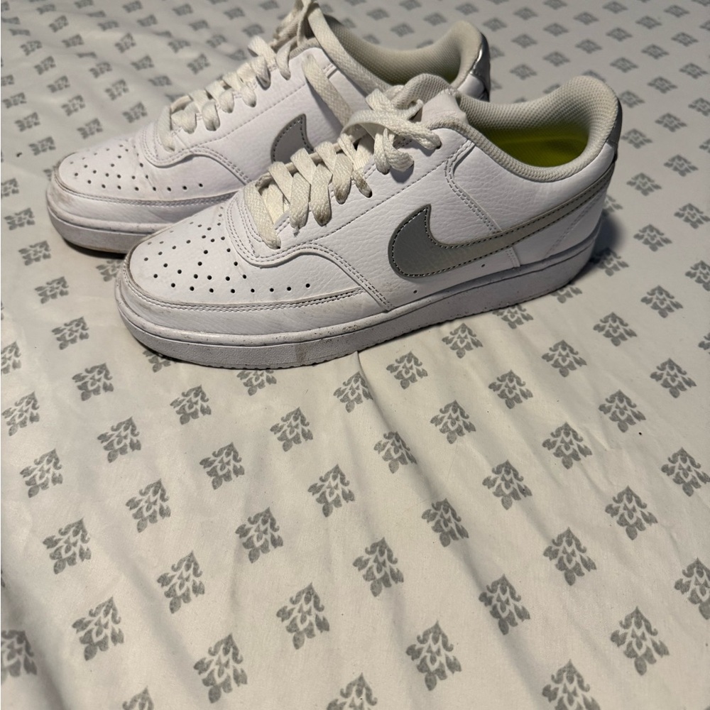 Woman’s White and silver Sneakers